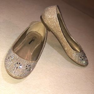 Gold flats with silver diamonds.